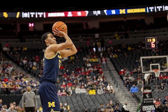 Juwan Howard and Caleb Houstan (22)