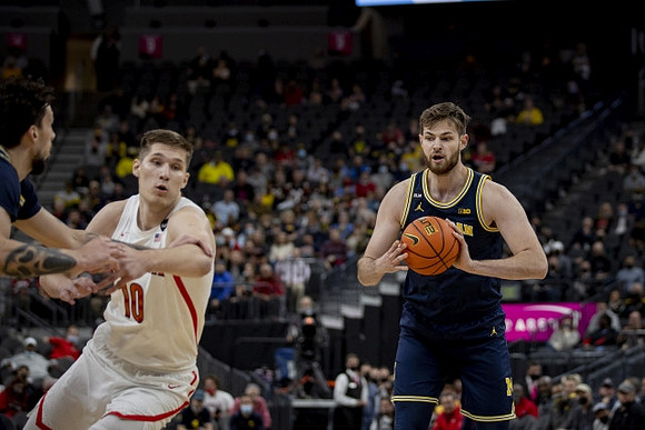 Brandon Johns Jr. (23) and Hunter Dickinson (1)