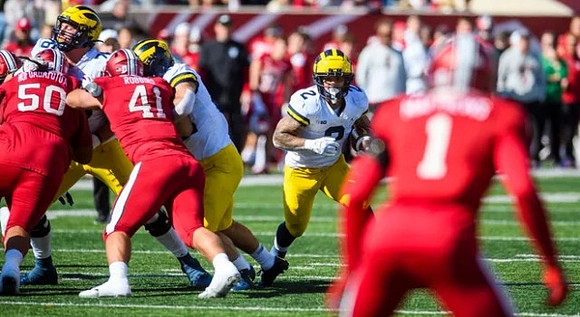 Blake Corum (2) and Ryan Hayes (76)
