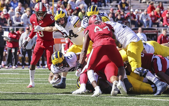 Blake Corum (2), Joel Honigford (84), and Karsen Barnhart (52)