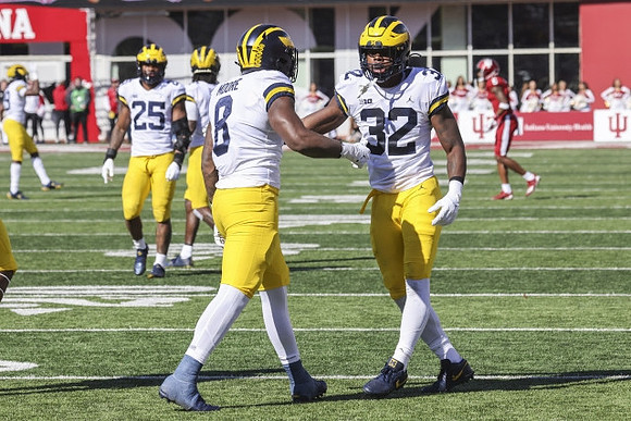 Junior Colson (25), Derrick Moore (8), and Jaylen Harrell (32)