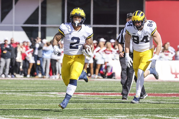 Blake Corum (2) and Joel Honigford (84)
