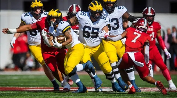 Joel Honigford (84), Blake Corum (2), Zak Zinter (65), and Trente Jones (53)
