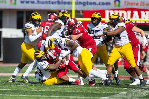 Michael Barrett (23), Mike Morris (90), Jaylen Harrell (32), and Junior Colson (25)