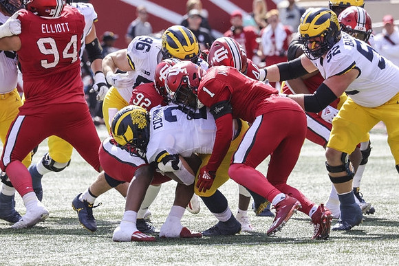 Blake Corum (2), Luke Schoonmaker (86), and Karsen Barnhart (52)