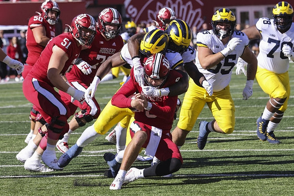 Derrick Moore (8), Jaylen Harrell (32), Mason Graham (55), and Kenneth Grant (78)