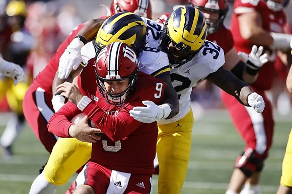 Derrick Moore (8) and Jaylen Harrell (32)