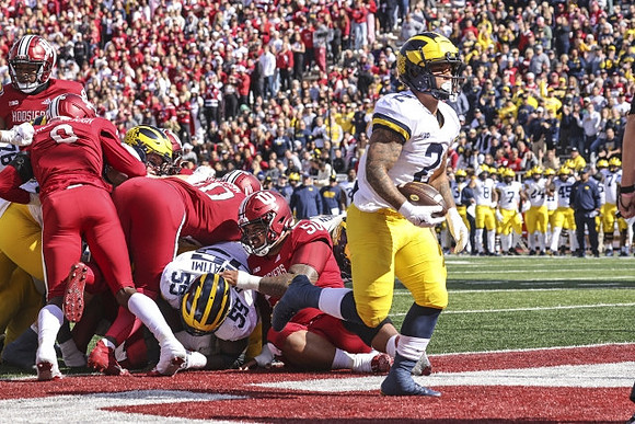 Ryan Hayes (76), Olusegun Oluwatimi (55), and Blake Corum (2)