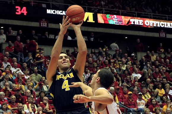 Spike Albrecht (2) and Jon Horford (15)