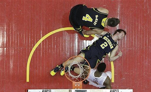 Mitch McGary (4) and Spike Albrecht (2)