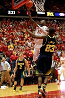 John Beilein, Spike Albrecht (2), and Caris LeVert (23)