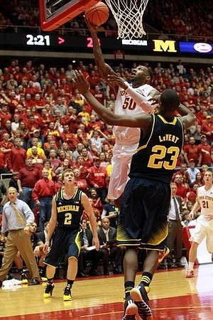 John Beilein, Spike Albrecht (2), and Caris LeVert (23)