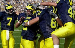 Anthony Thomas (32), Drew Henson (7), Bill Seymour (81), and Eric Rosel (40)