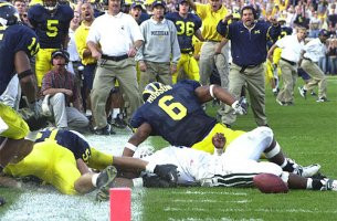 Victor Hobson (6), Larry Foote (17), Jim Herrmann, Brady Hoke, Lloyd Carr, Eric Brackins (51), James Whitley (5), and Brian Lafer (36)