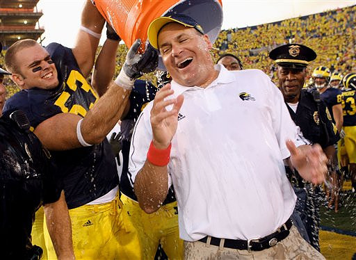 Ryan Van Bergen (53) and Rich Rodriguez