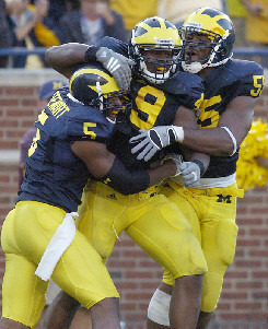 Charles Stewart (5), Marell Evans (9), and Brandon Graham (55)