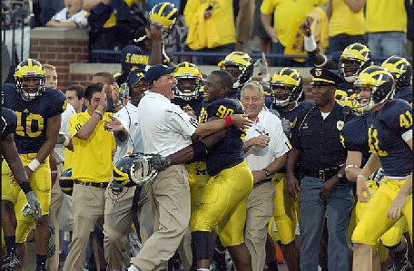 Rich Rodriguez, Tim Jamison (90), and Zoltan Mesko (41)