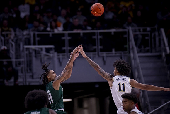 Isaiah Barnes (11) and Jace Howard (25)