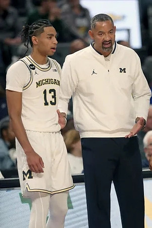 Jett Howard (13) and Juwan Howard