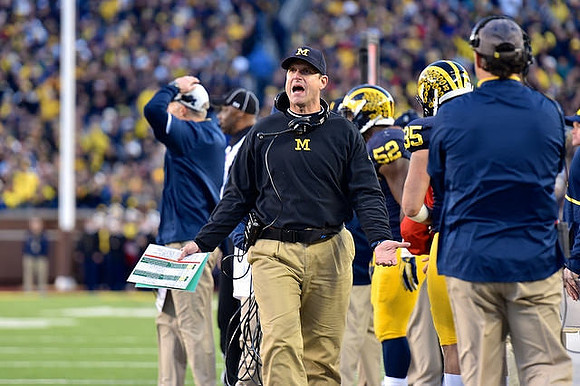 Jim Harbaugh, Royce Jenkins-Stone (52), and Joe Bolden (35)
