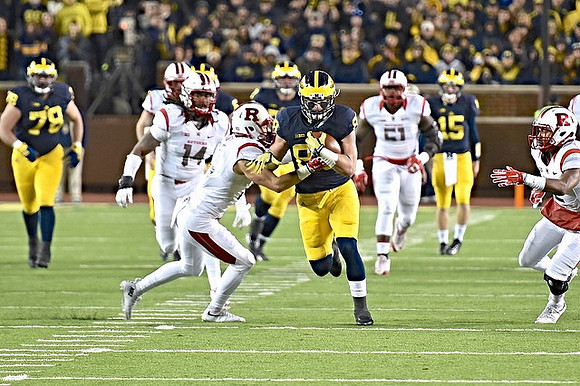 Erik Magnuson (78), Graham Glasgow (61), Jake Butt (88), and Jake Rudock (15)