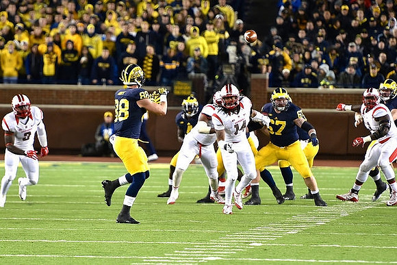 Jake Butt (88), De'Veon Smith (4), and Kyle Kalis (67)