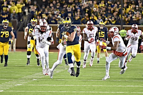 Erik Magnuson (78), Graham Glasgow (61), Jake Butt (88), and Jake Rudock (15)
