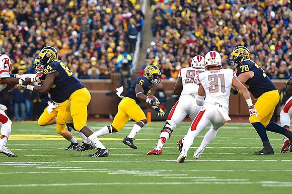 A.J. Williams (84), Jabrill Peppers (5), and Erik Magnuson (78)
