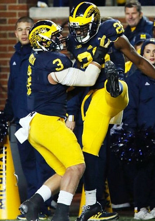 Desmond Morgan (3) and Jourdan Lewis (26)