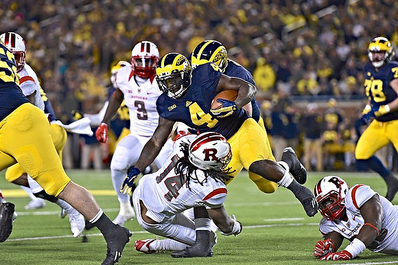 De'Veon Smith (4) and Erik Magnuson (78)