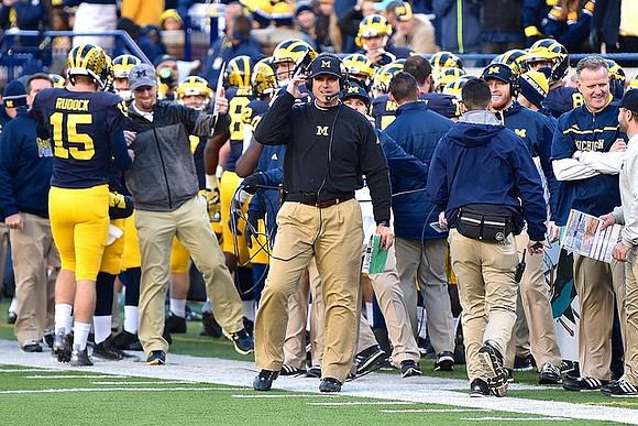 Jake Rudock (15) and Jim Harbaugh