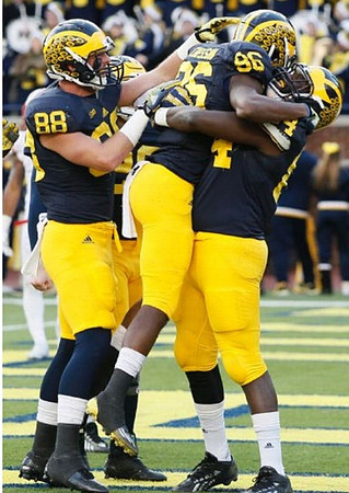 Jake Butt (88) and Jehu Chesson (86), and De'Veon Smith (4)