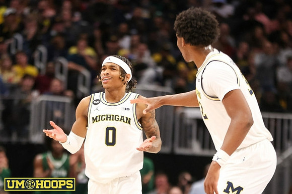 Dug McDaniel (0) and Tarris Reed Jr. (32)