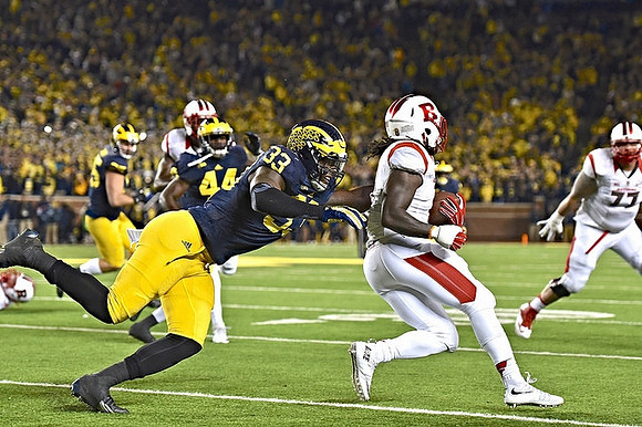 Taco Charlton (33), Delano Hill (44), and Joe Bolden (35)