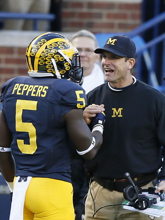 Jabrill Peppers (5) and Jim Harbaugh