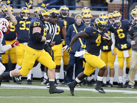 Kyle Kalis (67) and De'Veon Smith (4)