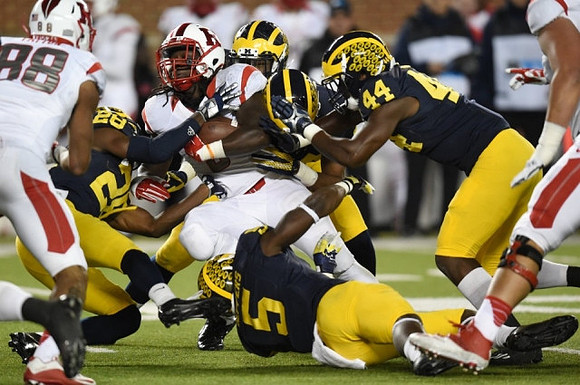 Jourdan Lewis (26), Jabrill Peppers (5), and Delano Hill (44)