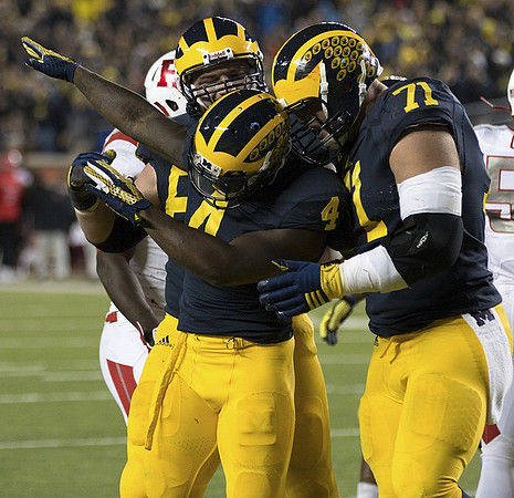 De'Veon Smith (4) and Ben Braden (71)