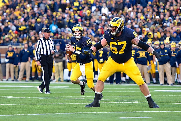 Jake Rudock (15) and Kyle Kalis (67)