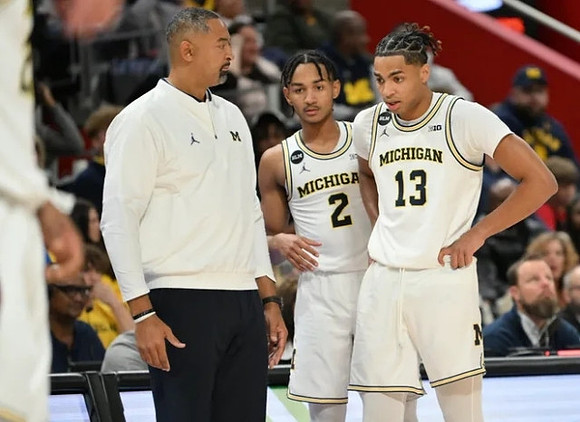 Juwan Howard, Kobe Bufkin (2), and Jett Howard (13)