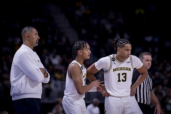 Juwan Howard, Kobe Bufkin (2), and Jett Howard (13)