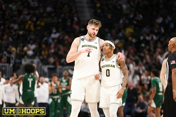 Hunter Dickinson (1) and Dug McDaniel (0)