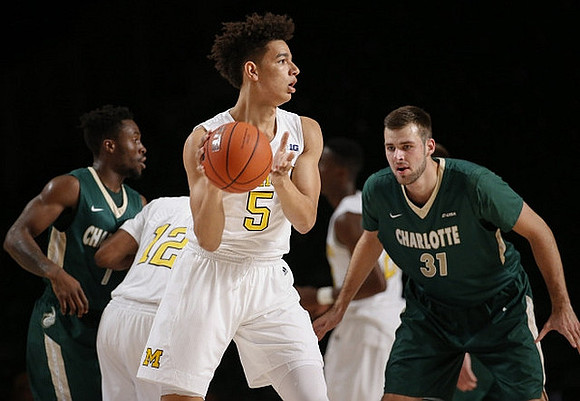 Muhammad-Ali Abdur-Rahkman (12) and D.J. Wilson (5)