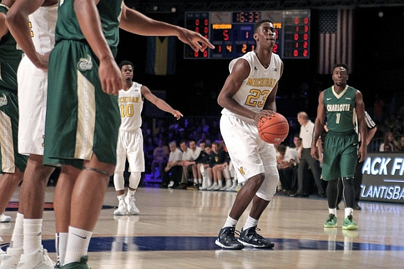 Derrick Walton Jr. (10) and Caris LeVert (23)