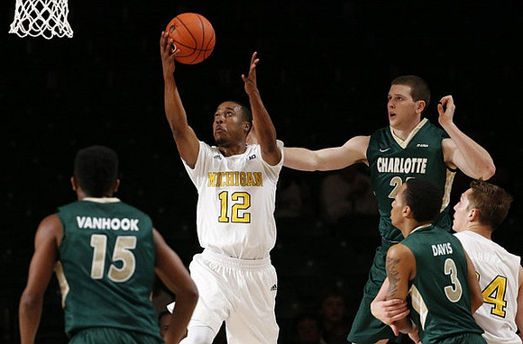 Muhammad-Ali Abdur-Rahkman (12) and Mark Donnal (34)