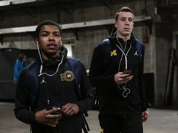 Rico Ozuna-Harrison (14) and Duncan Robinson (22)