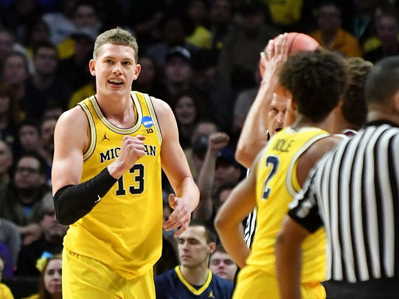 Moritz Wagner (13) and Jordan Poole (2)