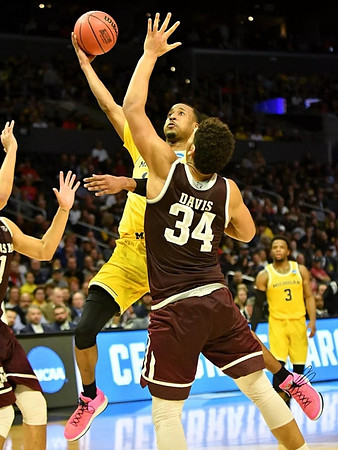 Muhammad-Ali Abdur-Rahkman (12) and Zavier Simpson (3)