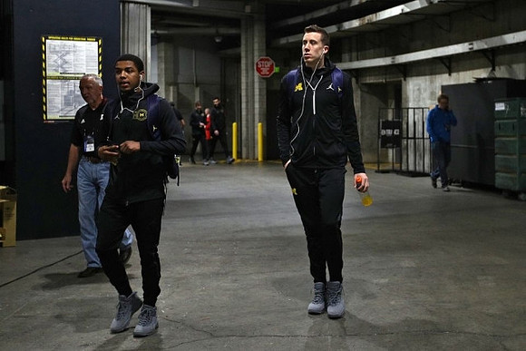 Rico Ozuna-Harrison (14) and Duncan Robinson (22)