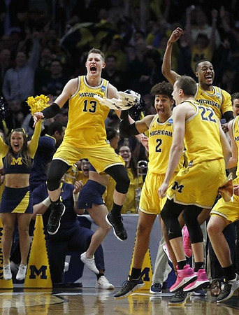 Moritz Wagner (13), Jordan Poole (2), Duncan Robinson (22), and Muhammad-Ali Abdur-Rahkman (12)